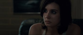 Movie still from “Animal Kingdom” (2010), directed by David Michôd – A person sitting down looking at the camera; Close Up shot, Over the shoulder angle