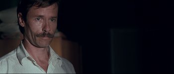 Movie still from “Animal Kingdom” (2010), directed by David Michôd – A person wearing a white dress shirt; Close Up shot, Over the shoulder angle