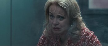 Movie still from “Animal Kingdom” (2010), directed by David Michôd – A person with blonde hair and blue eyes; Close Up shot, Over the shoulder angle