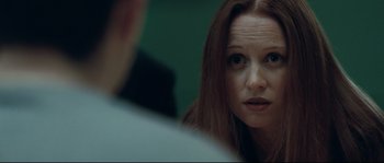 Movie still from “Animal Kingdom” (2010), directed by David Michôd – A person sitting in front of another person; Close Up shot, Over the shoulder angle