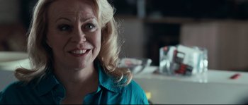 Movie still from “Animal Kingdom” (2010), directed by David Michôd – A person with blonde hair; Close Up shot, Over the shoulder angle