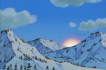 Movie still from “Animaniacs: Wakko's Wish” (1999), directed by Kirk Tingblad – The sun is setting over a snowy mountain range; Extreme Wide shot, Low angle