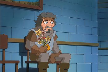 Movie still from “Animaniacs: Wakko's Wish” (1999), directed by Kirk Tingblad – An animated man sitting down holding a bouquet of flowers; Medium shot, Over the shoulder angle