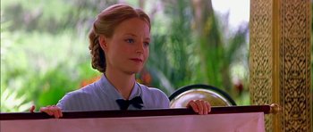 Movie still from “Anna and the King” (1999), directed by Andy Tennant – A young woman sitting in front of a steering wheel; Close Up shot, Low angle