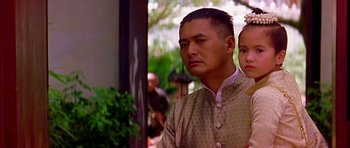 Movie still from “Anna and the King” (1999), directed by Andy Tennant – A man and a woman standing next to each other; Close Up shot, Low angle