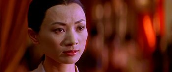 Movie still from “Anna and the King” (1999), directed by Andy Tennant – A woman's face in front of a blurry background; Close Up shot, Over the shoulder angle