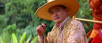 Movie still from “Anna and the King” (1999), directed by Andy Tennant – A man wearing a hat and holding a cigarette in his hand; Close Up shot, Low angle