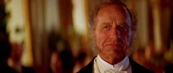 Movie still from “Anna and the King” (1999), directed by Andy Tennant – An old man with a beard and a bow tie in a suit; Close Up shot, Low angle