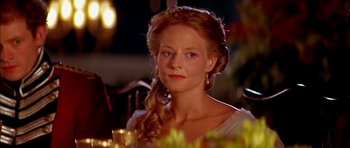 Movie still from “Anna and the King” (1999), directed by Andy Tennant – A woman with long red hair wearing a white dress; Close Up shot, Over the shoulder angle