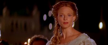 Movie still from “Anna and the King” (1999), directed by Andy Tennant – A woman with long red hair wearing a white dress; Close Up shot, Over the shoulder angle