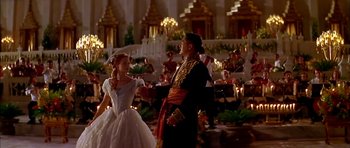 Movie still from “Anna and the King” (1999), directed by Andy Tennant – A man and a woman dancing in front of a crowd; Wide shot, Over the shoulder angle