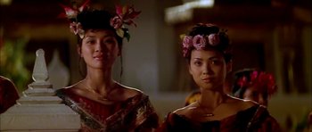 Movie still from “Anna and the King” (1999), directed by Andy Tennant – Two asian women with flowers in their hair; Close Up shot, Low angle