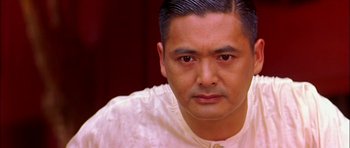 Movie still from “Anna and the King” (1999), directed by Andy Tennant – A person wearing a white shirt; Close Up shot, High angle