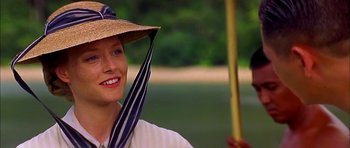 Movie still from “Anna and the King” (1999), directed by Andy Tennant – A woman wearing a hat and holding an umbrella; Close Up shot, Over the shoulder angle