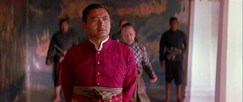 Movie still from “Anna and the King” (1999), directed by Andy Tennant – A man in a red shirt and a man in a black shirt and a man in a red shirt and a man in a black shirt; Medium shot, Low angle