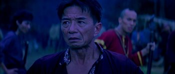 Movie still from “Anna and the King” (1999), directed by Andy Tennant – An older man looking at something in the distance; Close Up shot, Over the shoulder angle