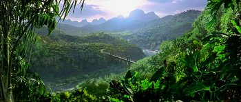 Movie still from “Anna and the King” (1999), directed by Andy Tennant – A view of a bridge over a river with mountains in the background; Extreme Wide shot, High angle