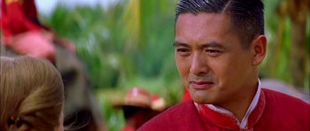 Movie still from “Anna and the King” (1999), directed by Andy Tennant – A person wearing a red shirt; Close Up shot, Over the shoulder angle