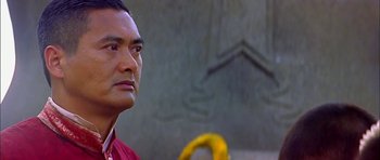 Movie still from “Anna and the King” (1999), directed by Andy Tennant – A person wearing a red shirt; Close Up shot, Low angle