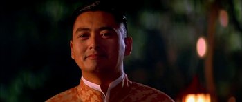 Movie still from “Anna and the King” (1999), directed by Andy Tennant – A person wearing an orange and white shirt; Close Up shot, Low angle