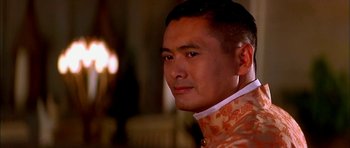 Movie still from “Anna and the King” (1999), directed by Andy Tennant – A person wearing a suit and tie; Close Up shot, Low angle