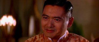 Movie still from “Anna and the King” (1999), directed by Andy Tennant – A person wearing a robe; Close Up shot, Over the shoulder angle