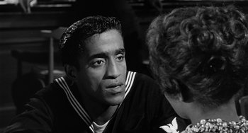 Movie still from “Anna Lucasta” (1958), directed by Arnold Laven – Black and white photograph of a man talking to a woman; Close Up shot, Over the shoulder angle