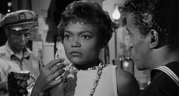 Movie still from “Anna Lucasta” (1958), directed by Arnold Laven – An old black and white photo of a woman; Close Up shot, Low angle