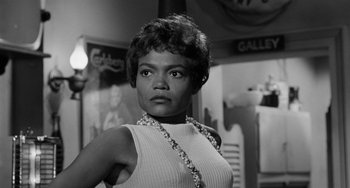 Movie still from “Anna Lucasta” (1958), directed by Arnold Laven – A black and white photo of a woman in a white top; Close Up shot, Low angle