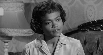 Movie still from “Anna Lucasta” (1958), directed by Arnold Laven – An old black and white photo of a woman; Close Up shot, Low angle