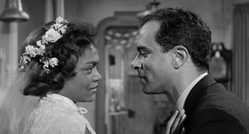 Movie still from “Anna Lucasta” (1958), directed by Arnold Laven – A man and a woman looking at each other in a room; Close Up shot, Low angle
