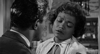 Movie still from “Anna Lucasta” (1958), directed by Arnold Laven – A man and a woman are looking at one another; Close Up shot, Over the shoulder angle