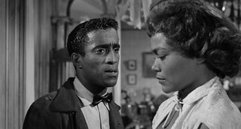 Movie still from “Anna Lucasta” (1958), directed by Arnold Laven – A black and white photo of a man and a woman; Close Up shot, Over the shoulder angle