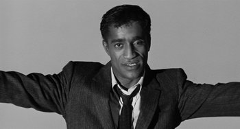 Movie still from “Anna Lucasta” (1958), directed by Arnold Laven – A black and white photo of a man wearing a suit and tie; Close Up shot, Low angle