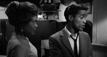 Movie still from “Anna Lucasta” (1958), directed by Arnold Laven – A black and white photo of a man and a woman; Medium shot, Low angle