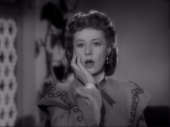 Movie still from “Anna and the King of Siam” (1946), directed by John Cromwell – A black - and - white photo of a woman in a dress; Close Up shot, Low angle