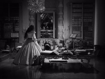 Movie still from “Anna and the King of Siam” (1946), directed by John Cromwell – A black and white photo of a woman in a dress; Wide shot, High angle