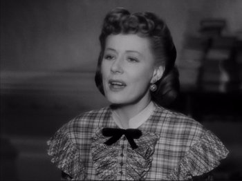 Movie still from “Anna and the King of Siam” (1946), directed by John Cromwell – An old photo of an older woman in a plaid dress; Close Up shot, Low angle