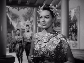 Movie still from “Anna and the King of Siam” (1946), directed by John Cromwell – A black and white photo of a woman in a dress; Medium shot, Low angle