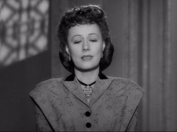 Movie still from “Anna and the King of Siam” (1946), directed by John Cromwell – An old photo of a woman in a dress; Close Up shot, Low angle