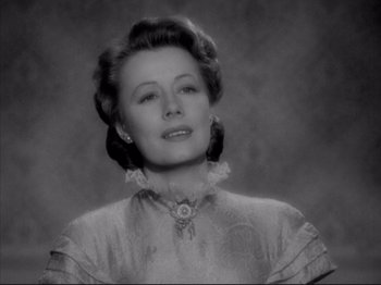 Movie still from “Anna and the King of Siam” (1946), directed by John Cromwell – An old photo of an older woman in a dress; Close Up shot, Low angle