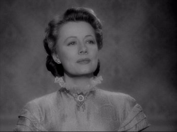 Movie still from “Anna and the King of Siam” (1946), directed by John Cromwell – An old photo of a woman in a white dress; Close Up shot, Low angle