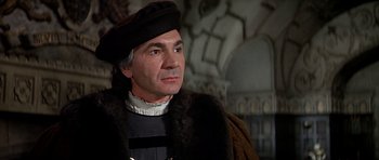 Movie still from “Anne of the Thousand Days” (1969), directed by Charles Jarrott – A person wearing a hat; Close Up shot, Over the shoulder angle