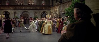 Movie still from “Anne of the Thousand Days” (1969), directed by Charles Jarrott – A group of people dressed in medieval costumes; Wide shot, High angle