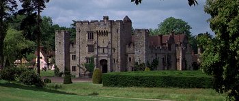 Movie still from “Anne of the Thousand Days” (1969), directed by Charles Jarrott – An old stone castle with trees in the background; Extreme Wide shot, High angle