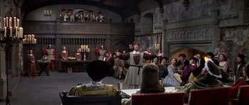 Movie still from “Anne of the Thousand Days” (1969), directed by Charles Jarrott – A group of people sitting around a room; Wide shot, High angle