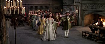 Movie still from “Anne of the Thousand Days” (1969), directed by Charles Jarrott – A group of people dressed in medieval costumes; Wide shot, High angle