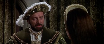 Movie still from “Anne of the Thousand Days” (1969), directed by Charles Jarrott – A man in a medieval costume looking at a woman in an elizabethan dress; Close Up shot, Over the shoulder angle