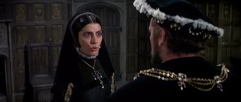 Movie still from “Anne of the Thousand Days” (1969), directed by Charles Jarrott – A man and a woman in medieval garb talking to each other; Close Up shot, Over the shoulder angle