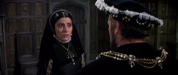 Movie still from “Anne of the Thousand Days” (1969), directed by Charles Jarrott – A woman in a black dress looking at a man in a black suit; Close Up shot, Over the shoulder angle